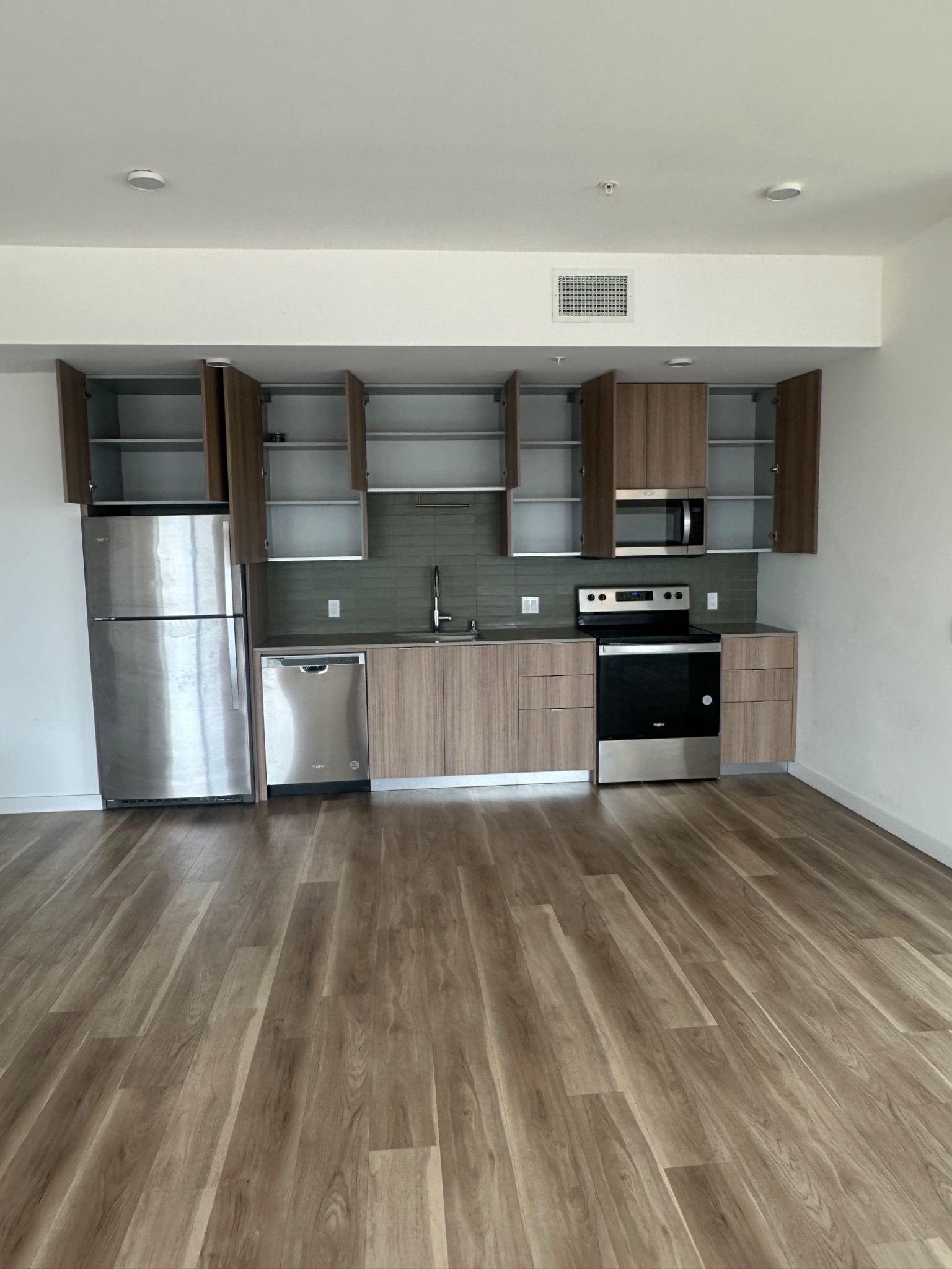 Clean modern kitchen cabinets and appliances